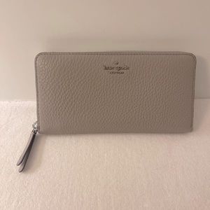 Kate Spade Wallet. Excellent Condition. Gray. Nice & Clean Inside & Out. 8”x4”.